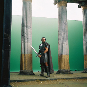 Henry Cavill as Theseus, standing in front of ancient Greek columns. Sword in hand, determined expression. Green backdrop