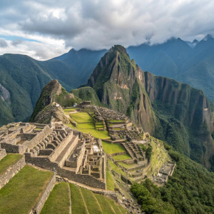 Aerial view of Machu Picchu, an ancient Incan city in Peru. Stone structures and terraced fields sprawl across the verdant hills, blending seamlessly with the natural landscape.
