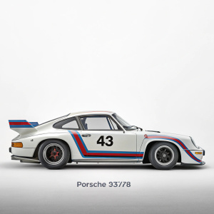 Illustration of a classic white Porsche 935/78 race car, number 43. Sleek design with red and blue accents. Grey base, white backdrop.