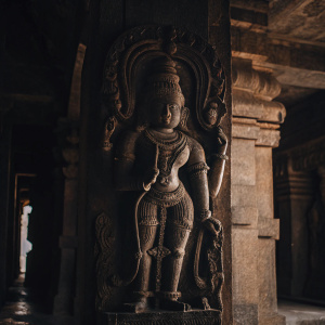 Detailed sculpture of Vamana avatar of Lord Vishnu. Located in ancient cave temples of Badami, Karnataka, India.