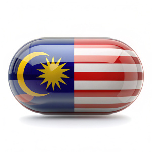 Pill capsule with Malaysian flag Healthcare in Malaysia isolated on white background