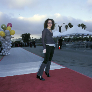Havan Flores at the Nickelodeon Kids' Choice Awards. Curly hair, dressed casually, glass-rimmed eyewear.