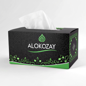 Modern digital design for Alokozay tissue box. Predominantly black and green color scheme. Arabic and English script, white tissues peeking out. Sleek, clean look.