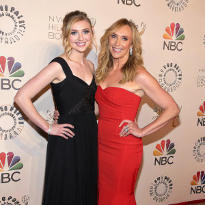 Imogen Poots and Toni Collette at the gala event, posing in front of a backdrop filled with sponsor logos.
