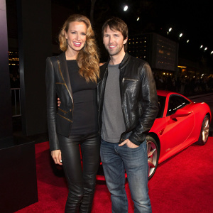 Petra Nemcova and James Blunt attending a Hollywood premiere. Petra in a sleek black top paired with a leather jacket and boots. James in a casual t-shirt and a leather jacket. They stand close, framed by a red carpet and a red sports car. Dark background with stylish lighting.