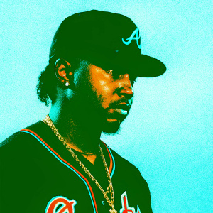 Close-up shot of Ozzie Albies, baseball player for Atlanta Braves, intense expression. Black and orange jersey with team logo. Gold necklace visible.