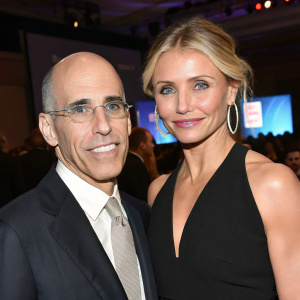Jeffrey Katzenberg and Cameron Diaz at a tech conference. Close-up shot, wearing glasses and earrings. Bald head, blonde hair