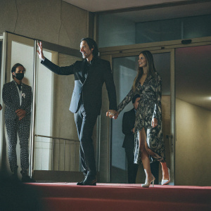 Adrian Brody and Lara Leito at the Cannes Film Festival premiere. Adrian in a black suit, Lara in a stunning dress.