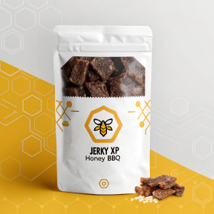 Digital ad showcasing Jerky XP's Honey BBQ beef jerky packaging. Predominantly white with brown and yellow accents. Logo at the bottom.