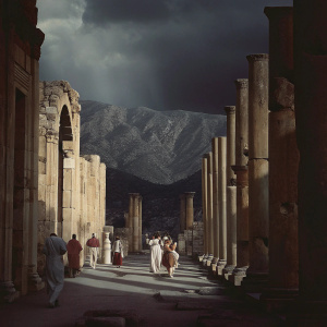 Illustration of ancient ruins in Hierapolis, Turkey. Stone columns and walls in different states of decay, from fully intact to completely collapsed. Against rugged mountain backdrop. Various people, representing diverse ethnicities and genders, dressed in traditional attire. Realistic style with emphasis on stone textures and detailed figures.