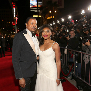 Terrence Howard and Taraji P. Henson at the star-studded premiere. Red carpet event with flashing cameras and paparazzi.
