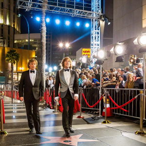 Robert Redford and Nick Nolte at the Hollywood Walk of Fame. Celebrating their latest film release. Crowds gathered, bright lights, star-studded event backdrop.