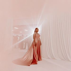 Kenya Moore, in a shimmering red gown, at the Grammy Awards ceremony.