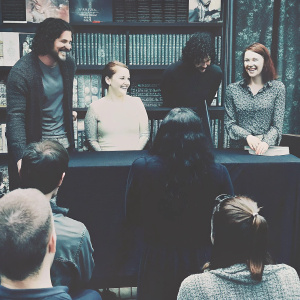 Kit Harington, Emilia Clarke, Maisie Williams, Natalie Dormer, and Rose Leslie at a bustling book signing event.