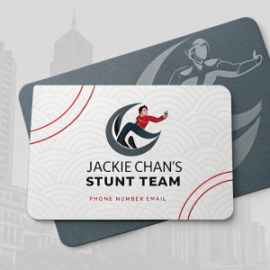 Professional business card featuring Jackie Chan's stunt team logo. Gray background, modern design. Includes team contact details.