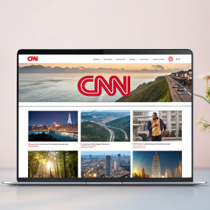 A screenshot of CNN homepage showcasing a sleek, minimalist grid layout with numerous news thumbnails. Each thumbnail features captivating images and headlines. Soft color palette