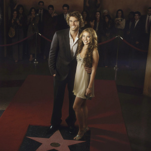 Liam Hemsworth and Miley Cyrus, posing at the Hollywood Walk of Fame event.