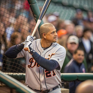 Victor Martinez, wearing Detroit Tigers jersey, at the batting cage. Fans in the background are blurred.