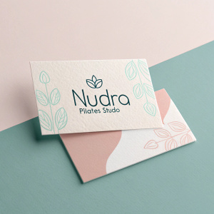 Modern business cards for Nudra Pilates Studio. Minimalist design, featuring pastel shades and clean typography.