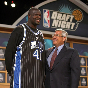 Shaquille O'Neal and NBA Commissioner David Stern at the draft night. Shaq wears his Orlando Magic jersey, posing confidently