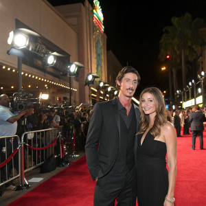 Eric Balfour and Erin Chiamulon at the grand premiere of 'The Offer'. Paramour Studios, red carpet event, film crew in the background.