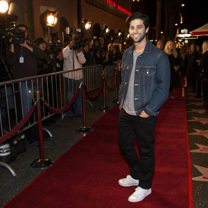 Josh Peck at the Hollywood premiere of '13 Going on 30'. Dressed in casual attire: denim jacket, t-shirt, black pants, and white sneakers. Star-studded red carpet with paparazzi.
