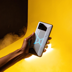 High-tech showcase of the ASUS ROG Phone 5 Ultimate. Sleek design, dark and dramatic lighting. Powerful specs and gaming performance highlighted. Futuristic backdrop