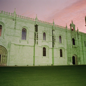 Jerónimos Monastery facade at sunset. Stunning with golden light highlighting its complex details and statues.
