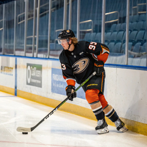 Jakob Silfverberg, hockey player, practicing in arena. Wearing Anaheim Ducks jersey number 93. Surrounded by blue boards and glass