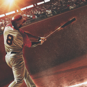 Justin Upton, wearing the number 8 jersey, swinging a bat. The stadium's crowd is a blur in the background. A sunny day at the baseball game.