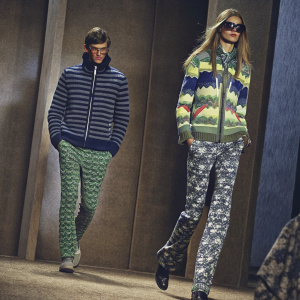 Models displaying Nautica's latest collection. Vibrant clothing with marine-themed patterns. Ad highlights clothing designs and model poses.
