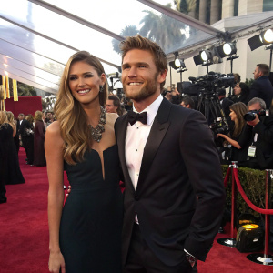 Scott Eastwood and Brittany Brousseau at a glamorous awards show. Red carpet, flashing cameras