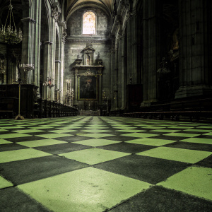 Interior of Jerez de la Frontera Cathedral. Checkerboard floor and intricate historical details visible.