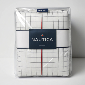 Nautica bed linens package, minimalist design with white grid pattern, prominently featuring Nautica logo. Wrapped in clear plastic. 'FULL SET' sticker on top.