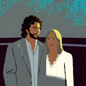 Aaron Taylor-Johnson, sporting a stubble and curly brown hair, in a gray blazer and white shirt, alongside Sam Taylor-Johnson, fair-skinned with blonde hair, in a white lace blouse. They are at a press event, standing in front of a green screen with abstract patterns.