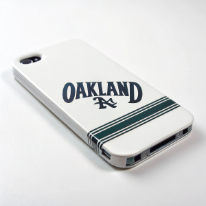 Custom iPhone 4/4S case featuring the bold 'OAKLAND' text in dark font on a sleek white background.