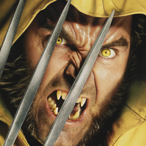 Close-up of Wolverine's fierce expression, set against a stark black backdrop.