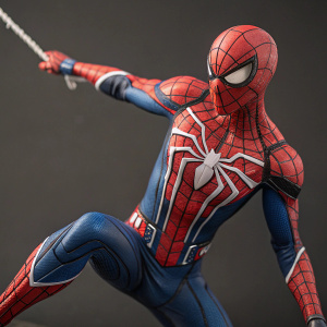 A highly detailed action figure of Spider-Man in mid-swing pose. Life-size bust with intricate web-patterns and Marvel branding. High-quality collectible toy
