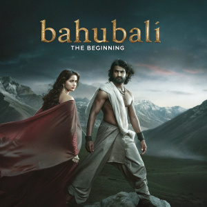 Promotional poster for 'Bahubali: The Beginning', featuring Prabhas and Tamannaah. Epic mountain backdrop.