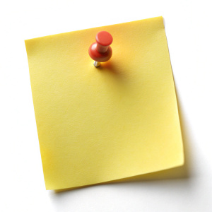 Blank yellow sticky note with thumbtack on white background