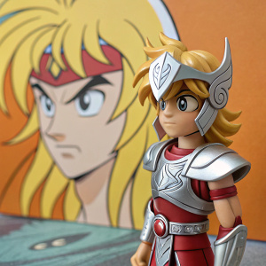 Close-up of Hyoga from Saint Seiya, detailed figurine with armor and determined look. Beside it, a warm, cartoonish illustration of Hyoga. Background is a mix of cartoon elements, focusing on Hyoga's face and vibrant colors.