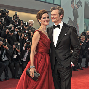 Colin Firth and Livia Firth at Venice Film Festival. Red carpet, paparazzi in the background