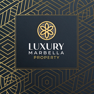 Luxury Marbella Property logo. Gold emblem and modern text centered on a dark background with intricate geometric patterns.