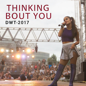 Ariana Grande at a concert. Backdrop with glowing lights and the words 'Thinking Bout You DWT-2017'.