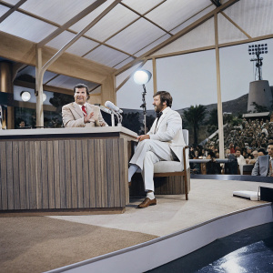 Mike Wallace and Jay Leno on The Tonight Show Starring Johnny Carson set. Jay Leno hosts, Mike Wallace as guest. Studio audience present.