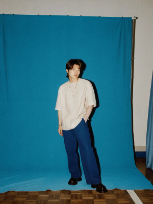 Skinny handsome asian guy in oversized white t-shirt, fashion photoshoot, full outfit is stylish, short mullet hairstyle, high detailed face shape, front view