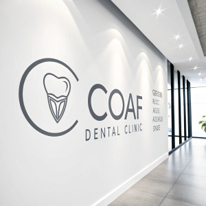 The COAF dental clinic logo is a sleek, modern design with a subtle, grayscale dental icon on a bright, white backdrop.