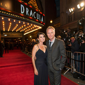Sadie Frost and Gary Kemp at the Dracula premiere. Glitzy venue, red carpet, flashing cameras.