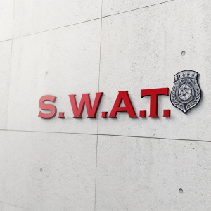 A sleek, modern logo featuring the acronym 'S.W.A.T.' in bold red letters against a white backdrop, accompanied by a subtle police badge icon.