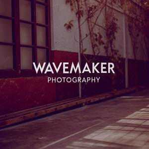 WaveMaker Photography logo design. Bold and sleek text 'Wavemaker Photography' in a modern sans-serif font. Color palette: black and white